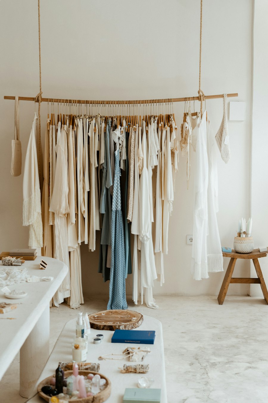 A clothing rail with linen garments in a bright boutique